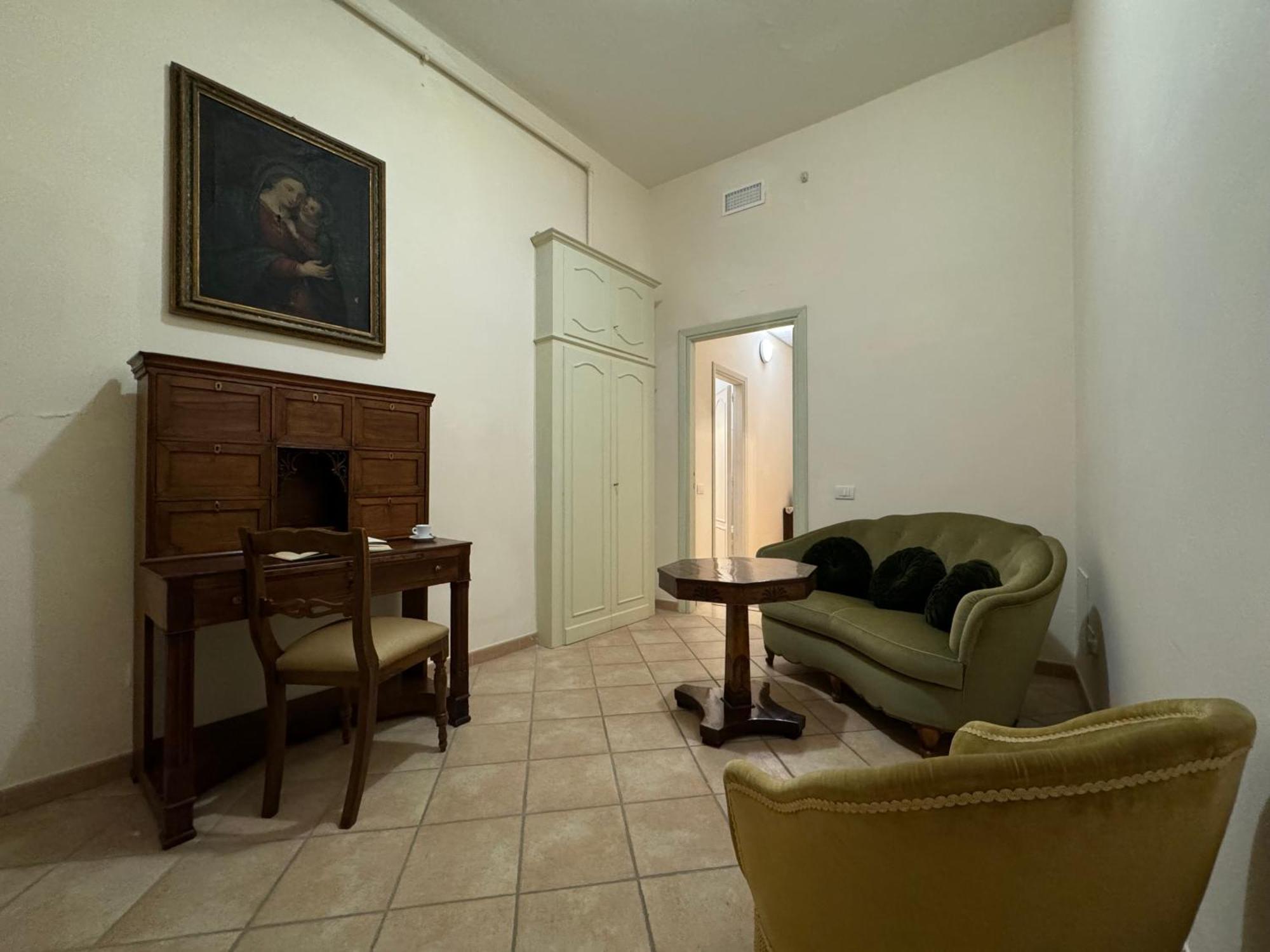 Hotel Monastero Ss. Annunziata Todi Exteriér fotografie The living room of the apartment